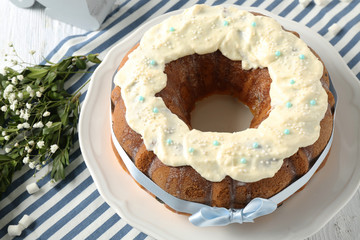 Wall Mural - Plate with tasty Easter cake on table