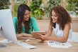© WavebreakMediaMicro - Female graphic designers discussing over digital tablet