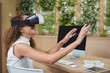 © WavebreakMediaMicro - Female business executive using virtual reality headset