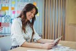 © WavebreakMediaMicro - Female graphic designer using digital tablet at desk
