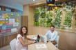 © WavebreakMediaMicro - Portrait of graphic designers sitting at desk and using laptop