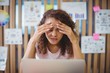 © WavebreakMediaMicro - Frustrated female graphic designer with laptop siting at desk