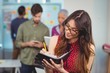 © WavebreakMediaMicro - Female business executive writing in organizer