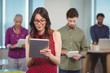© WavebreakMediaMicro - Business executives using digital tablet