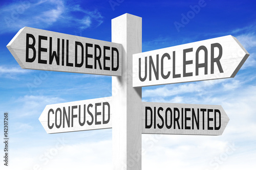 Fotografie, Obraz Confused concept (bewildered, unclear, confuses, disoriented) - wooden signpost