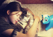 teen girl hug cuddle cat in bed
