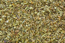Closeup Texture Of Dried Blend Italian Seasoning Mix. Spices Consist Of Basil, Oregano, Rosemary, Thyme, Sage, Cilantro As Main Ingredients To Flavor Italian Dishes
