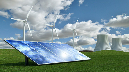 Alternative energy concept with wind turbines, solar panels and nuclear energy power plant.