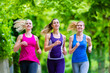 © Kzenon - Women in forest running for sport