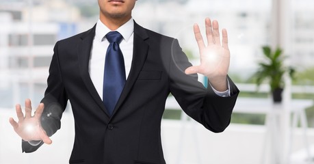 Wall Mural - Business man mid section with flares on hands in blurry office