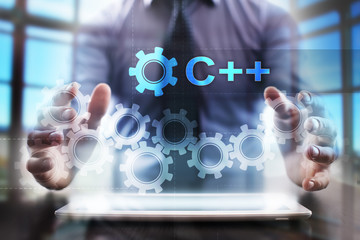 Wall Mural - Businessman using tablet pc and selecting c++.