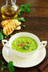 Wall Mural - Soup of green peas with bacon and mint.