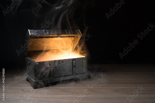 pandoras box with smoke on a wooden background