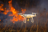 Fototapeta Konie - Flying drone in a fire
