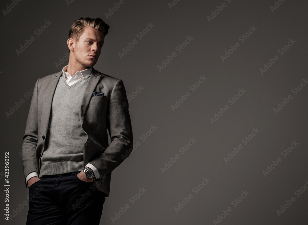 Confident sharp dressed man in grey jacket Stock Photo | Adobe Stock