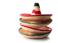 Mexican Hats Or "sombreros" Stacked Up On Top Of Each Other, On A White Background