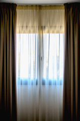  Translucent curtain hung on a window