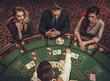 © Nejron Photo - Upper class friends gambling in a casino