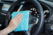 © Have a nice day  - Hand with microfiber cloth cleaning car.woman cleaning car interior - car detailing and valeting concept in car wash car care station ,selective focus,vintage color