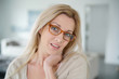 © goodluz - Portrait of beautiful blond woman with eyeglasses