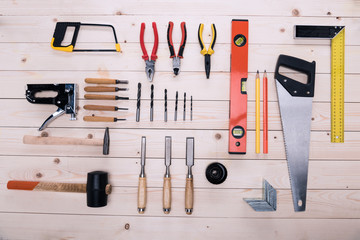 Top view of set of construction tools on wooden table