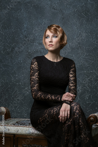 Vintage Portrait Of Elegant Blonde Woman With A Wave Hairstyle And
