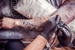 © Mr. Prof - Professional tattooer makes tattoo in tattoo studio