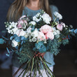 © cherry_d - Florist at work: pretty young blond woman holds fashion modern bouquet of different flowers