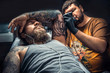 © Mr. Prof - Professional tattooist posing in studio