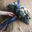© cherry_d - Florist at work: pretty young blond woman holds fashion modern bouquet of different flowers