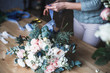 © cherry_d - Florist at work: pretty young blond woman holds fashion modern bouquet of different flowers