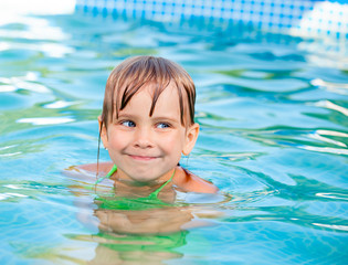 Child swimming in a pool