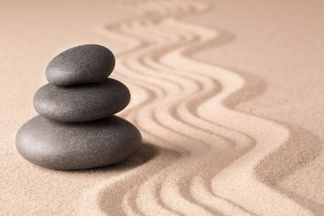 Poster - Balance of a pile or stack of stones in a Japanese zen meditation garden. Spa wellness hot stone therapy...