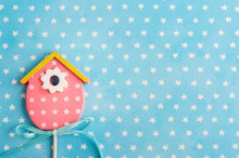 Blue White Stars Background With Pink Bird House