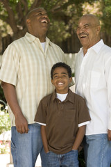 Wall Mural - Grandfather with his adult son and grandchild.