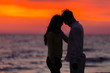 © FS-Stock - sunset silhouette of young couple in love hugging at beach