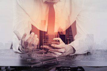 Poster - close up of businessman working with smart phone on wooden desk in modern office
