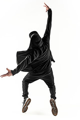 The silhouette of one hip hop male break dancer dancing on white background