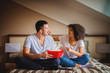 © Dusan Petkovic - Couple enjoying sharing time at home with movie and popcorn.