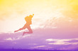 Silhouette of a man jumping with happy in the sunset.