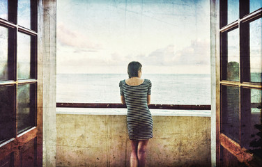 Young beautiful slender girl decollete dress balcony Malecon embankment El Morro fortress Havana Cuba Atlantic Ocean