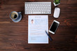 © Africa Studio - Resume, phone and keyboard on wooden table