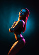 © Acronym - Young, beautiful and seductive girl posing in swimsuit. Mixed and fashionable lightning effect.