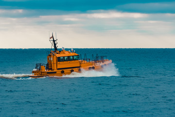 Sticker - Orange pilot ship moving fast in Baltic sea. Europe