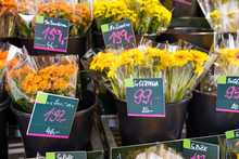 Flowers For Sale At A Street City Shop With Price Tags