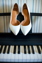 Wedding Shoes For The Bride On Piano Keys