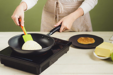 House wife wearing apron making. Steps of making cooking pancake.