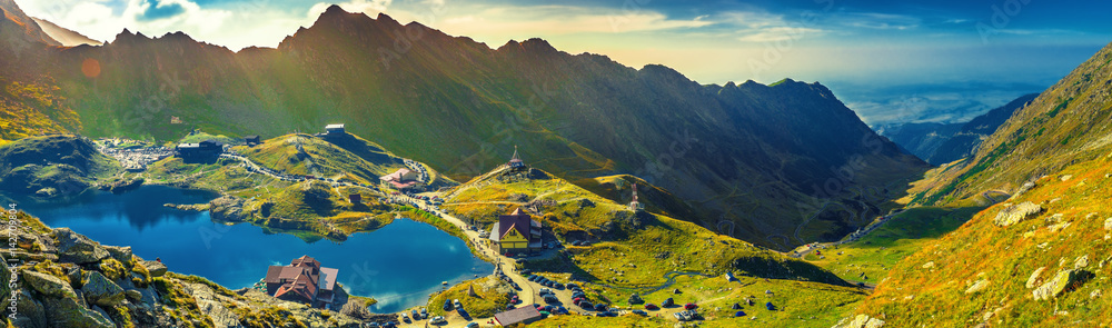 Transfagarasan Balea glacier lake, panoramic view - Lake, is a glacier lake situated at 2.034 m. of altitude in the Mountains, in central Romania, Sibiu County. - obrazy, fototapety, plakaty 