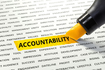 Word Accountability highlighted with marker on paper of other related words.business concept.