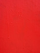 Red metal texture with a roughness and drops of paint surface. Grunge urban background.
